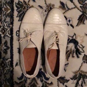 White leather oxfords.